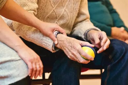 <p>Photo of younger hands holding an older set of hands</p>
