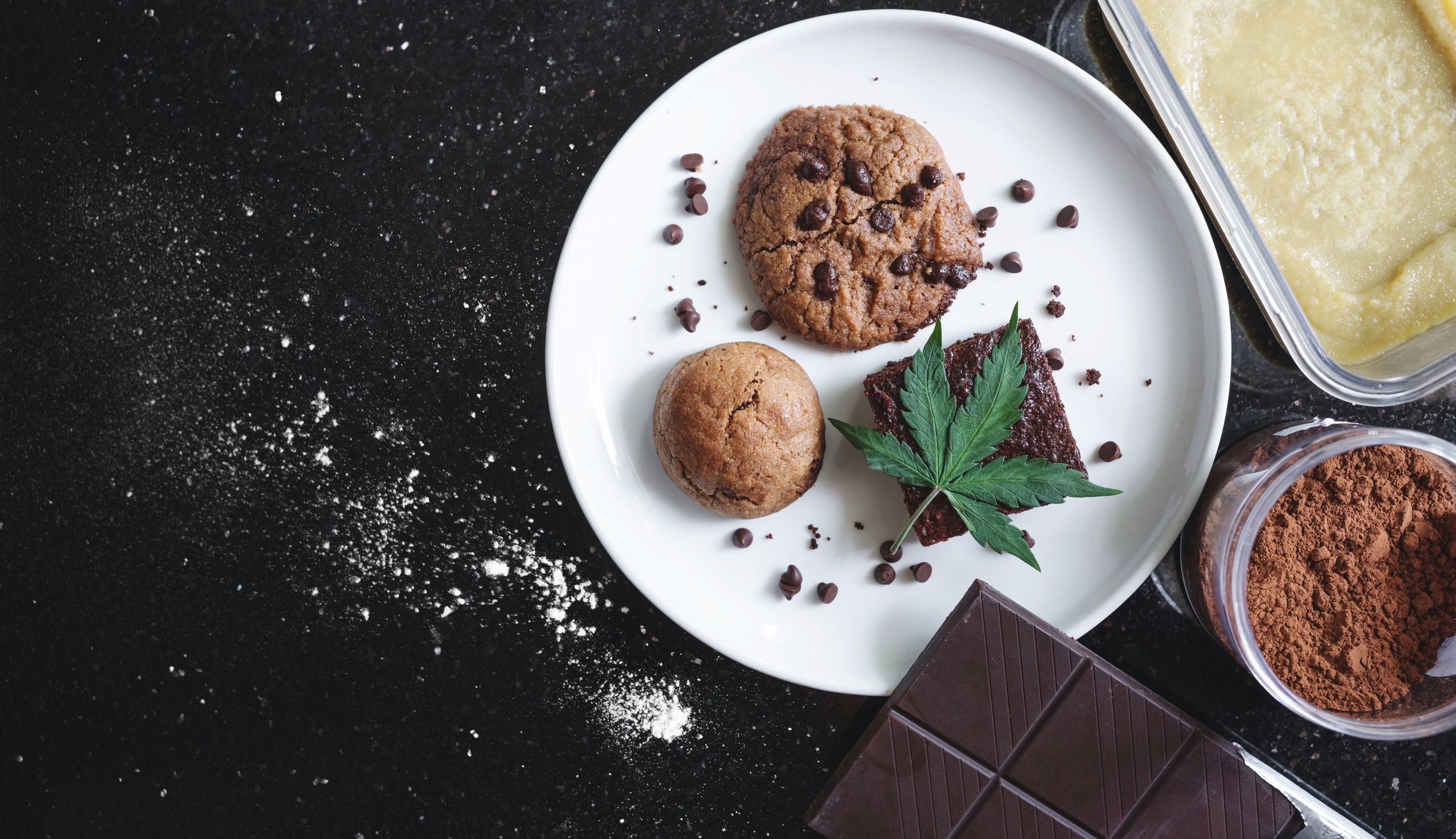 Baked desserts cookie, brownie and bun infused with cannabis, with cannabis leaf and ingredients