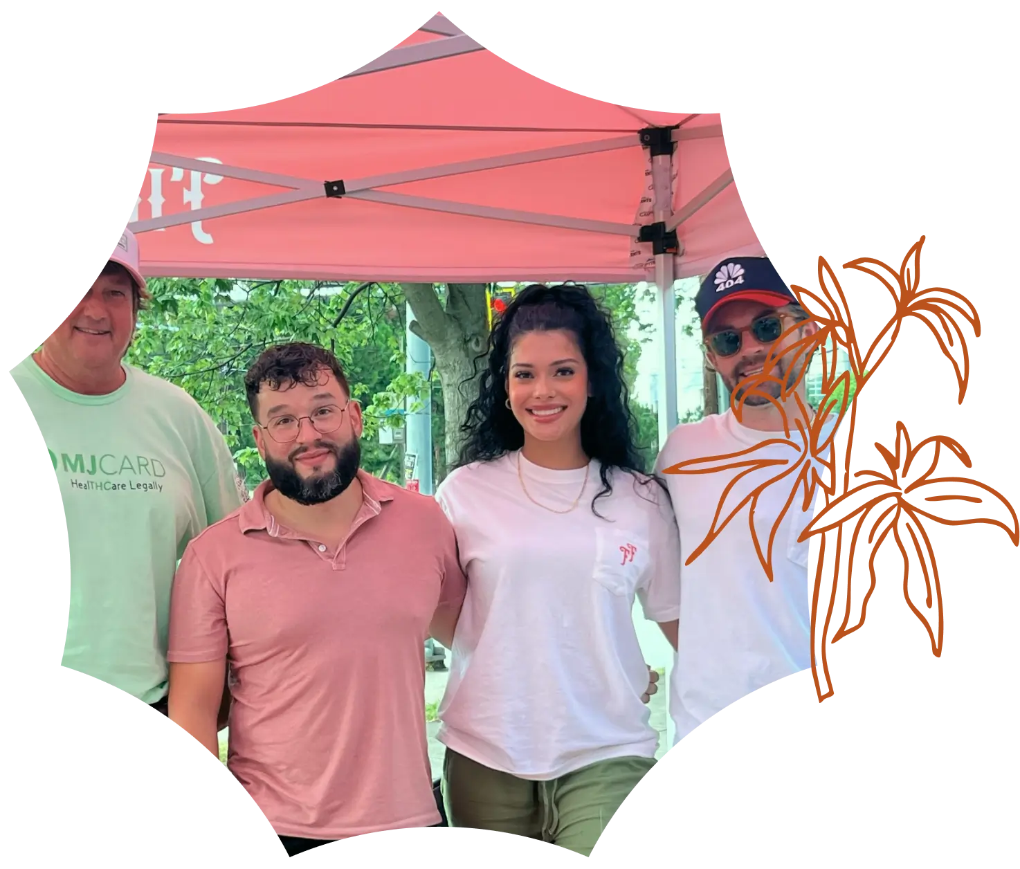 Four people posing and smiling under a canopy tent outdoors, with trees in the background and an orange palm tree graphic overlay on the right at a Georgia dispensary event.