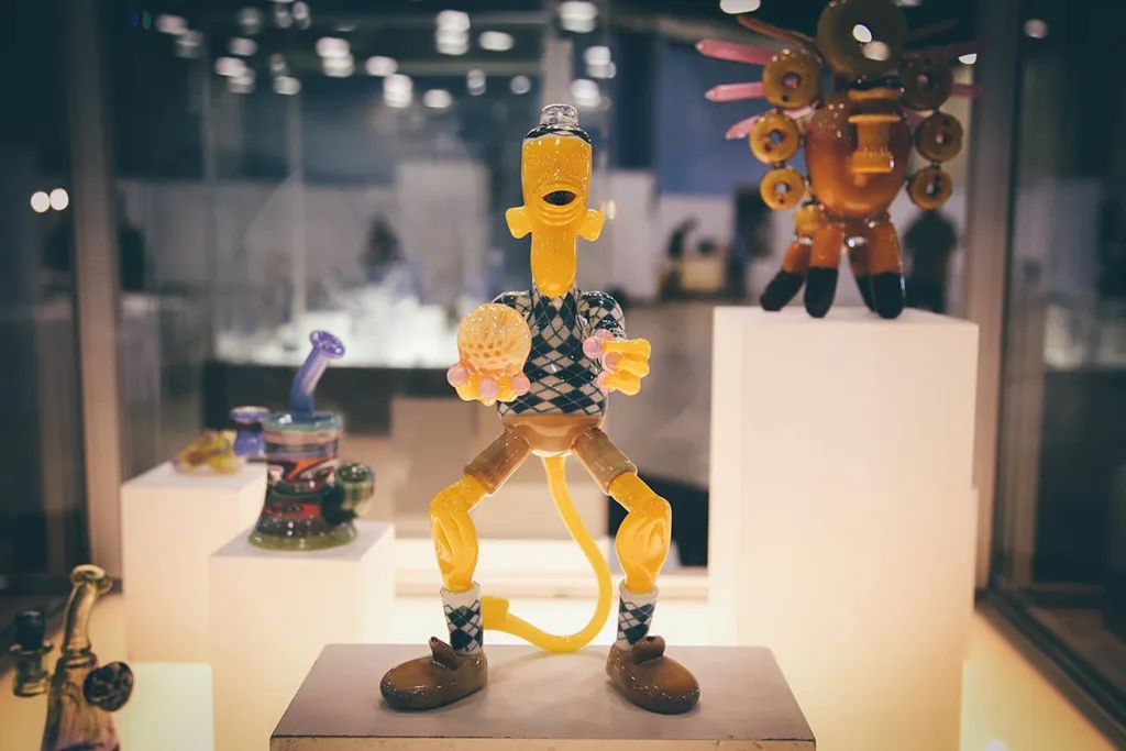 A whimsical, humanoid glass sculpture dab rig
