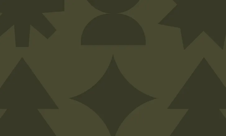 Dark green geometric shapes, including trees, diamonds, stars, and circles, arranged in a repeating pattern on a slightly lighter green background.