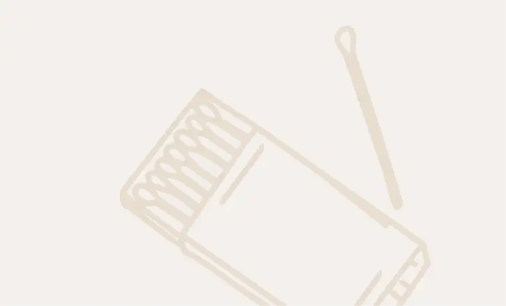 A simple line drawing of an open matchbox with matches inside, next to a single matchstick on a plain light background.