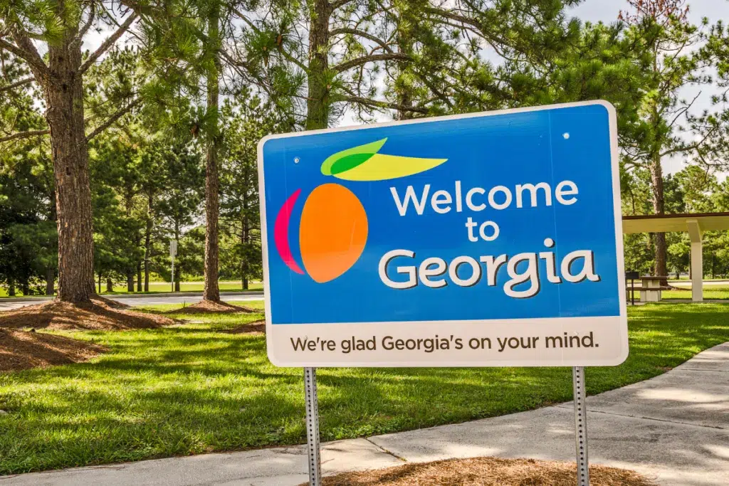 Sunny day with a blue “Welcome to Georgia” sign